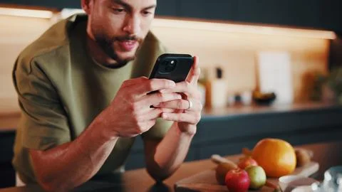 Recipe, reading or man in kitchen with phone, online instruction or cooking.. Stock Photos