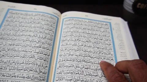 Reciting the Holy Quran on a Table Stock Footage 299304466