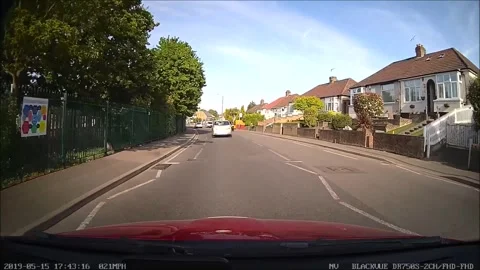 Reckless driver in London pulls out in front of two cars, almost causing a smash Video stock 272907282