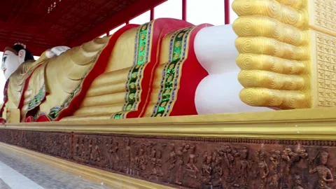 A reclining Buddha in a Buddhist temple Wat Khu Sang Stock Footage 244943473