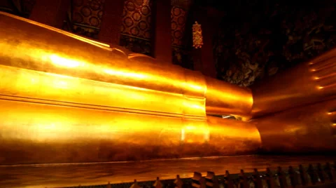 Reclining Buddha gold statue face. Wat Pho Stock Footage 36333534