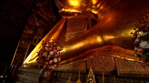 Reclining golding Buddha gold statue face. Stock Footage 36333250