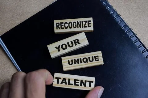 Recognize your unique talent on stacked wooden cubes on the table. Stock Photos