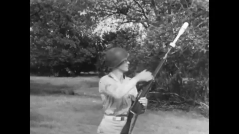 The recoil action of a rifle grenade is compared to the recoilless firing of an Stock-Footage 79515348