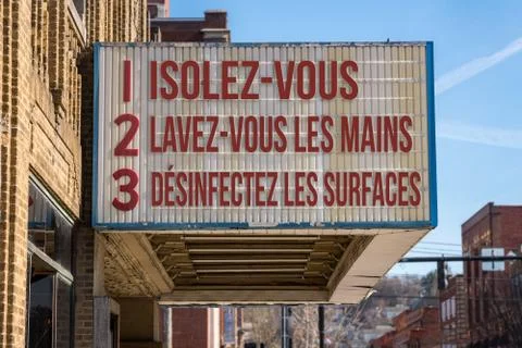 Recommendations for avoiding Coronavirus on cinema board in French language Stock Photos
