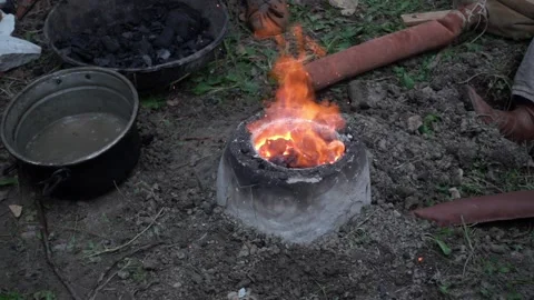 Reconstruction of an ancient Celtic bellows forge for the fusion of bronze on th Stock-Footage 135246880