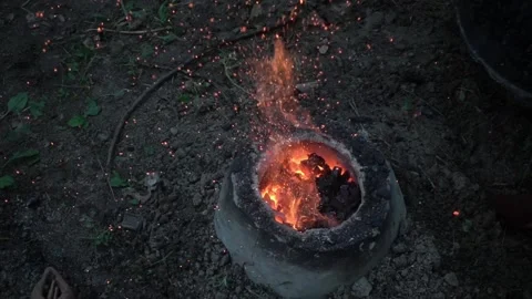 Reconstruction of an ancient Celtic bellows forge for the fusion of bronze on th Stock-Footage 135246899