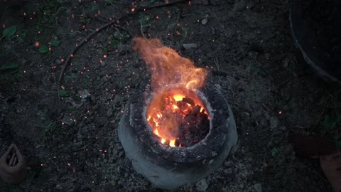 Reconstruction of an ancient Celtic bellows forge for the fusion of bronze on th Stock Footage 135246910