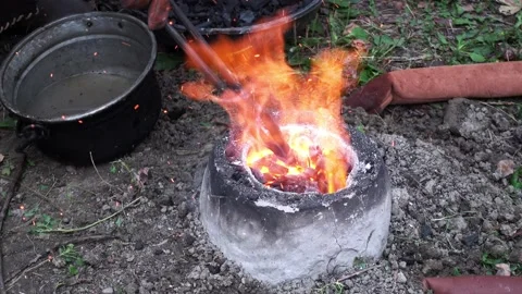 Reconstruction of an ancient Celtic bellows forge for the fusion of bronze on th Stock-Footage 135247210