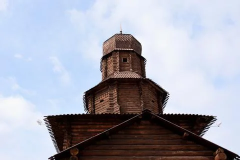 Reconstruction of an ancient watchtower built of logs with a high dome on top Stock Photos