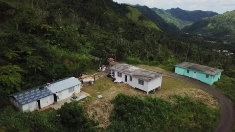 Reconstruction and Humanitarian Relief on Mountaintop, 4K Aerial Stock Footage