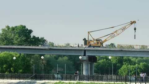 Reconstruction of a bridge over river. Timelapse Vídeos de archivo 75850375