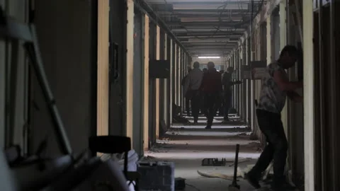 Reconstruction of the corridor. Workers carry out repair work in the corridor of Stock Footage 201411252