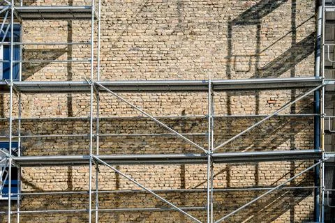 Reconstruction of an old brick house. Scaffolding for construction, construction Stock Photos