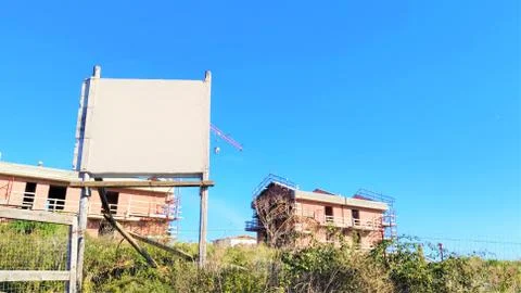 Reconstruction work using scaffolding. Composition for building company. Symb Stock Photos