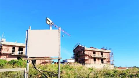 Reconstruction work using scaffolding. Composition for building company. Symb Fotos Stock