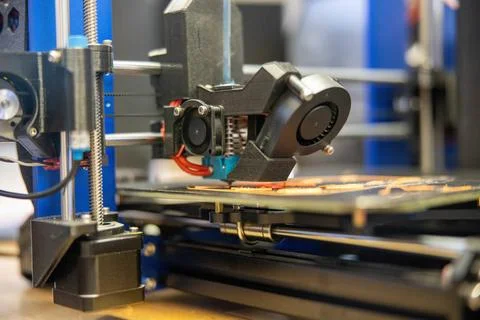 RECORD DATE NOT STATED A 3D printer works on creating a new object during ... Stock Photos