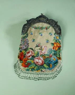 RECORD DATE NOT STATED  Bag. Knitting of polychrome pearls on beige backgr... Photos