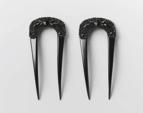 RECORD DATE NOT STATED  Black plastic hair comb, U-shaped, the round back ... Photos