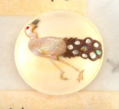 RECORD DATE NOT STATED Button (Japan); ivory, mother-of-pearl Copyright: x... Stock Photos