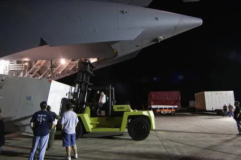 RECORD DATE NOT STATED  CAPE CANAVERAL, Fla. -- Workers unload a container... Stock Photos