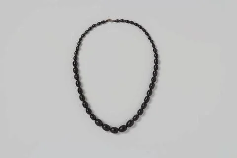 RECORD DATE NOT STATED  Chain of black wooden beads, decreasing in size, a... 库存照片