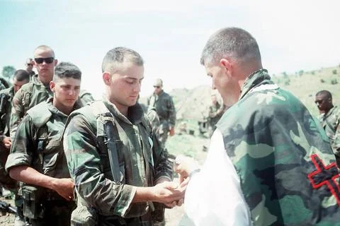 RECORD DATE NOT STATED Chaplain (LT.) William D. Devine distributes Holy C... Fotos Stock