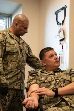 RECORD DATE NOT STATED  Chief Hospital Corpsman Victor Suanier,left, Naval... Stock Photos
