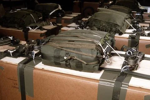 RECORD DATE NOT STATED A close-up of parachute rigging on pallets of suppl... Stock Photos