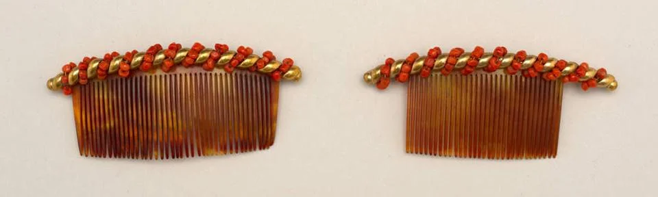 RECORD DATE NOT STATED Combs (Italy); tortoiseshell, coral, gold Copyright... Stock Photos