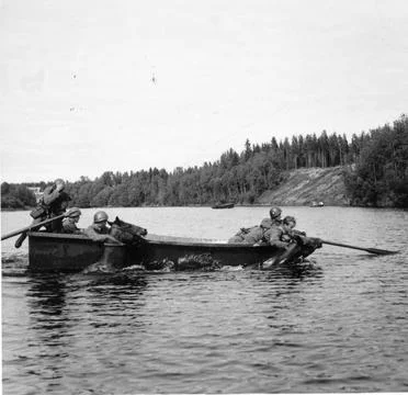 RECORD DATE NOT STATED Conscripts lead a horse over water route by boat. N... Stock Photos
