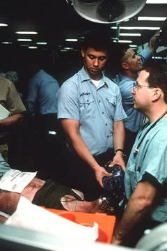 RECORD DATE NOT STATED A corpsman assists in anesthetizing a patient durin... Stock Photos