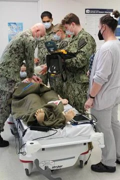 RECORD DATE NOT STATED Corpsmen practice their CPR and AED skills using a ... Stock Photos