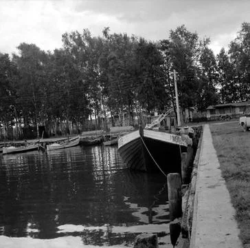 RECORD DATE NOT STATED A couple of boats are located on some jetties in a ... Fotos Stock