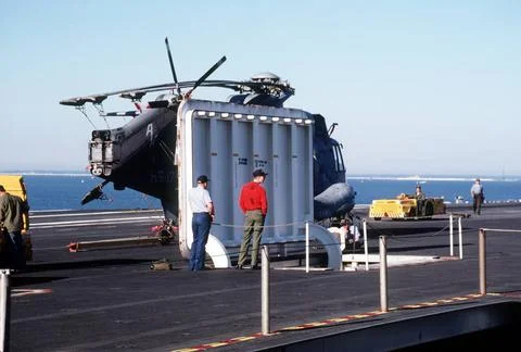 RECORD DATE NOT STATED Crew members stand beside an open magazine elevator... Foto stock