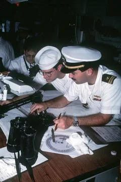 RECORD DATE NOT STATED Crew members plot the course of the destroyer USS O... Fotos de archivo