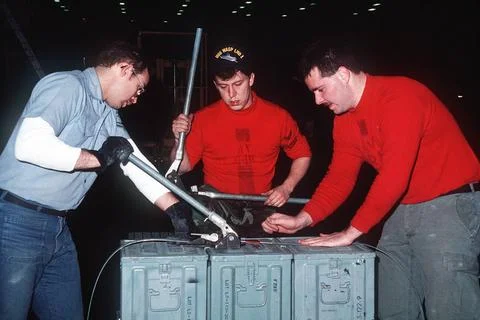RECORD DATE NOT STATED Crew members bind ordnance containers together prio... Stock Photos