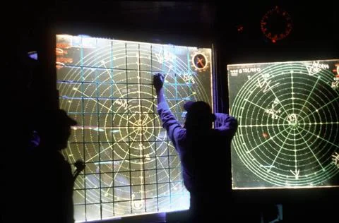 RECORD DATE NOT STATED A crewmen marks a plotting board in a shipboard com... Stock Photos