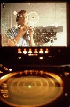 RECORD DATE NOT STATED A crewmen marks a plotting board in a shipboard com... Stock Photos