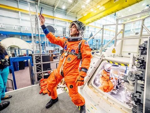 RECORD DATE NOT STATED  Engineers and astronauts conduct testing in a repr... Stock Photos