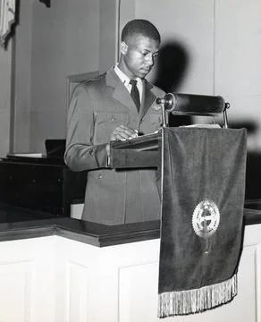 RECORD DATE NOT STATED Ensign Jesse Brown Reading Scripture in the Chapel ... Stock Photos