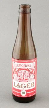 RECORD DATE NOT STATED Flaska Broken glass beer bottle. Label in red, whit... Stock Photos