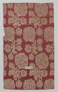 RECORD DATE NOT STATED  Fragment of red half -sides tissue with floral pat... Stock Photos