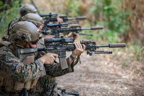 RECORD DATE NOT STATED  A group of U.S. Marines fires their M27 Infantry A... Stock Photos