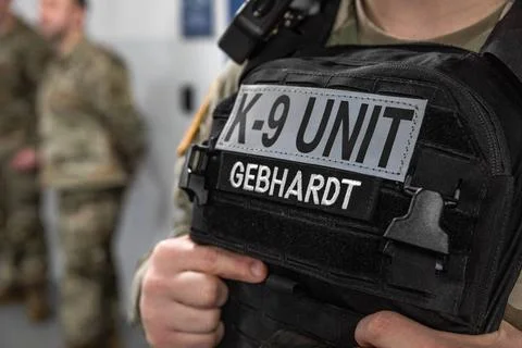 RECORD DATE NOT STATED A K-9 Unit patch is displayed on the tactical vest ... Stock Photos