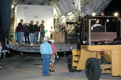 RECORD DATE NOT STATED  KENNEDY SPACE CENTER, FLA. - A forklift moves into... Photos