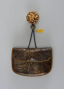 RECORD DATE NOT STATED Kin-chaku (purse) With Netsuke And Ojime On Chord ;... Stock Photos