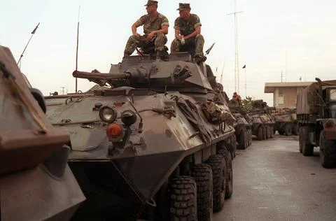 RECORD DATE NOT STATED Marines relax on the turret of an LAV-25 light armo... Stock Photos