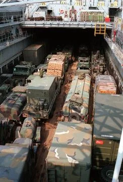 RECORD DATE NOT STATED Marines work to secure vehicles in the well deck of... Stock Photos