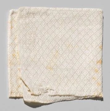 RECORD DATE NOT STATED  Napkin, fragment, with a pattern of diamonds with ... Foto stock
